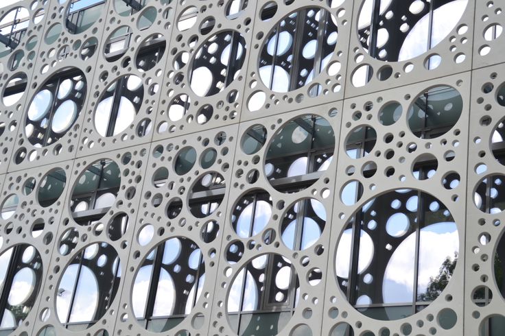 Perforated curtain wall panels